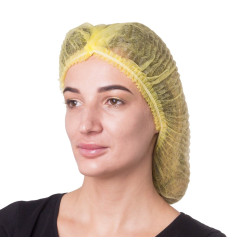 Spunbond hats with elastic band SANGIG, 100 pcs per pack (yellow)